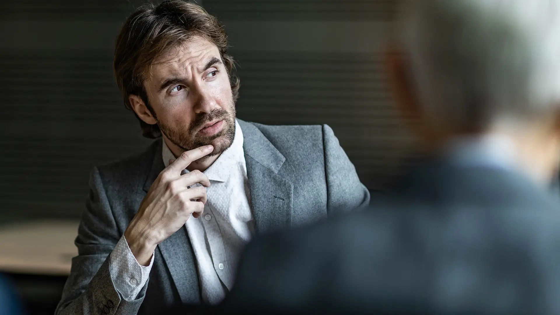 Quiet Observer – Step 3 - Reputation Matters Bearded man in suit listening with focus and curiosity