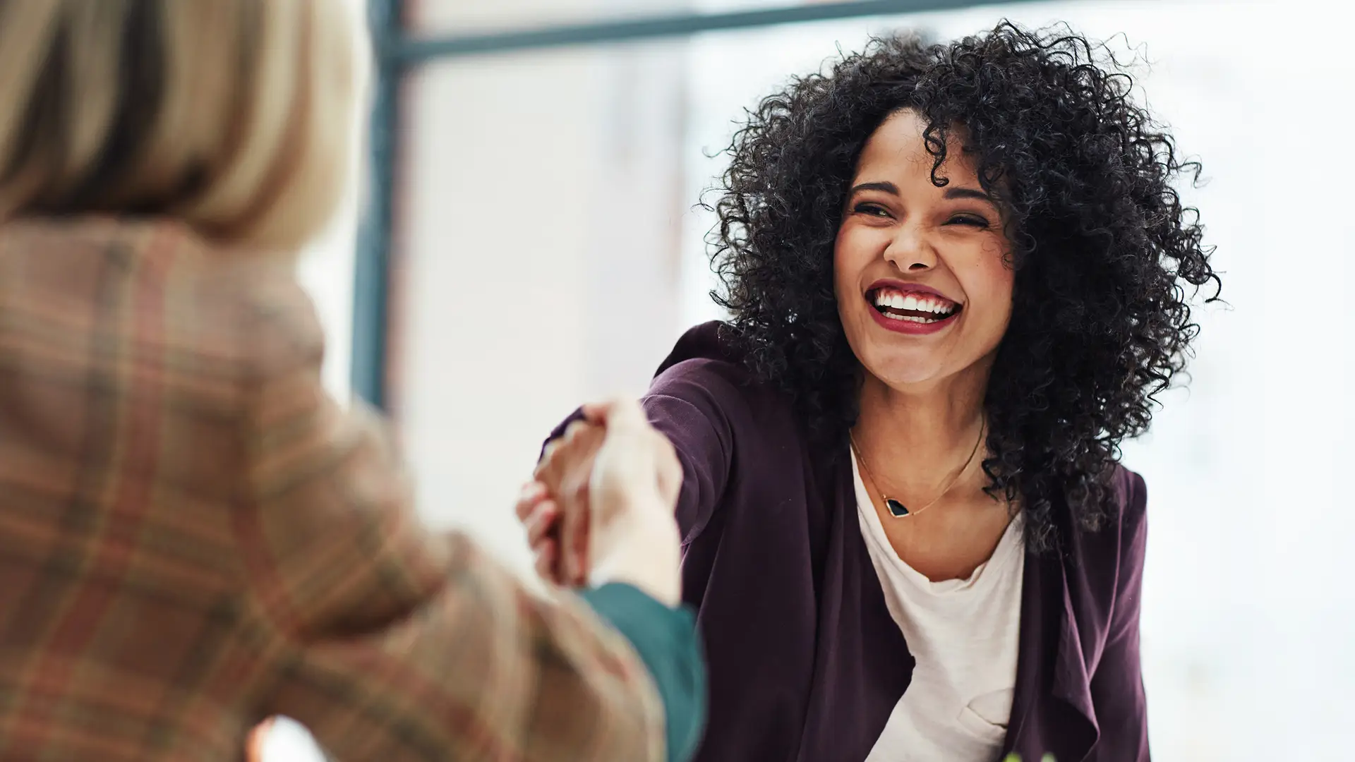 Smiling Woman Greeting – Step 4 - Reputation Matters Warm, confident woman extending a hand in greeting