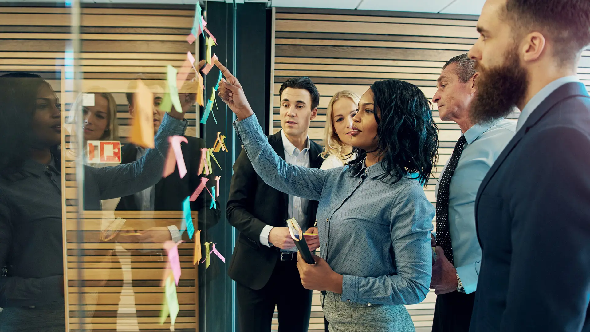 Business team mapping out messaging components to break through competing noise.